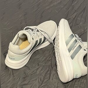 Adidas light aqua colored running shoes.